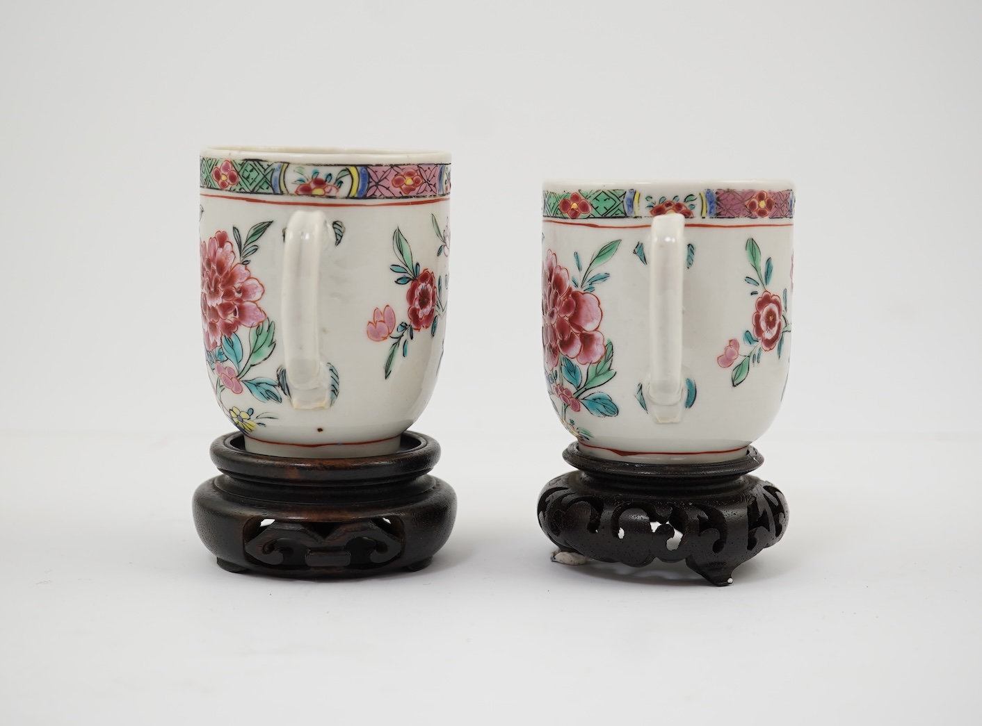 A near pair of Chinese famille rose ‘double pheasant’ coffee cups, early Qianlong period